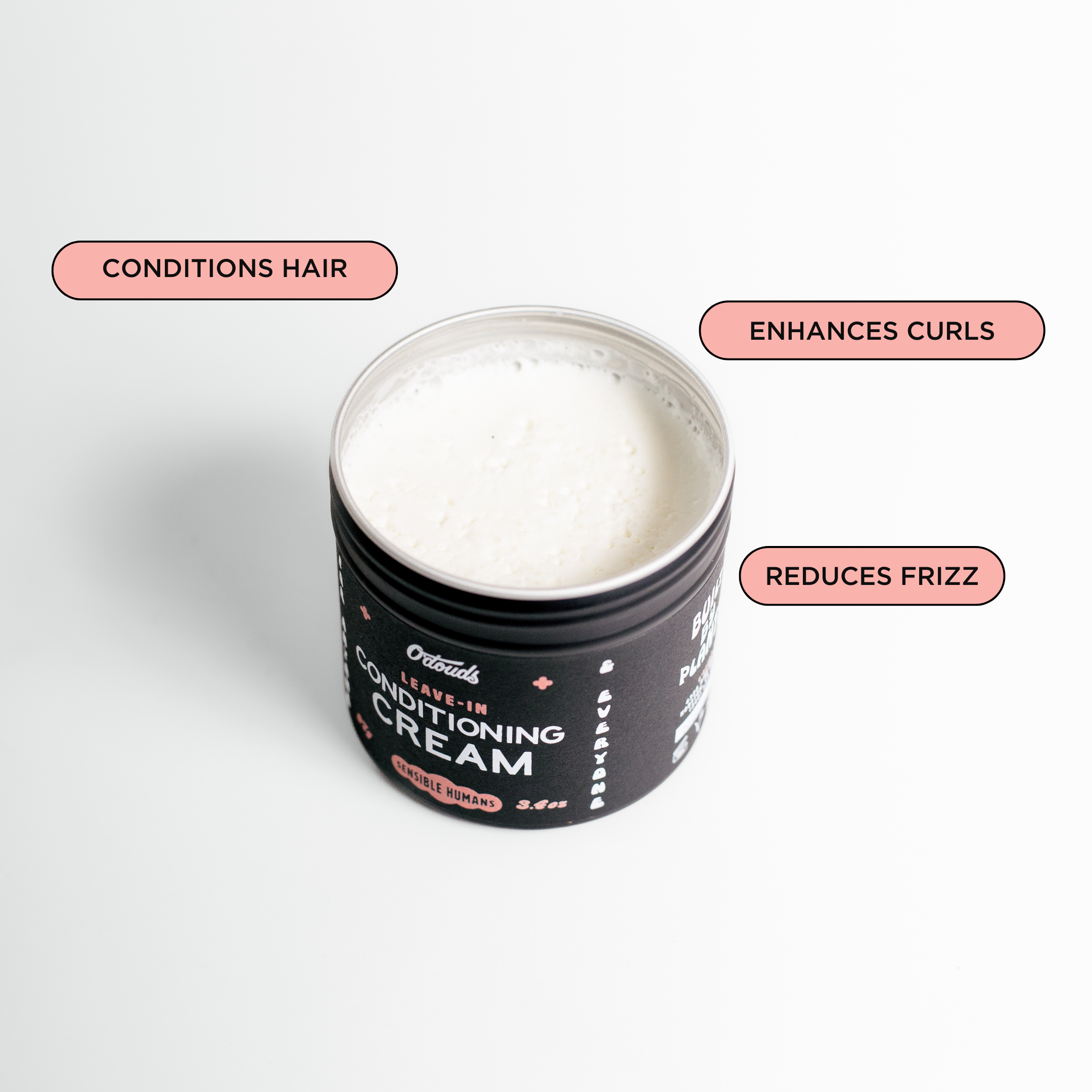 Jar of leave-in conditioning cream with text on a white background