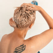 Lathered Pumpkin Seed Oil Shampoo in woman's short hair shower