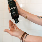 Tea Tree and Grapefruit Scented O'douds Pumpkin Seed Oil Shampoo poured into hand