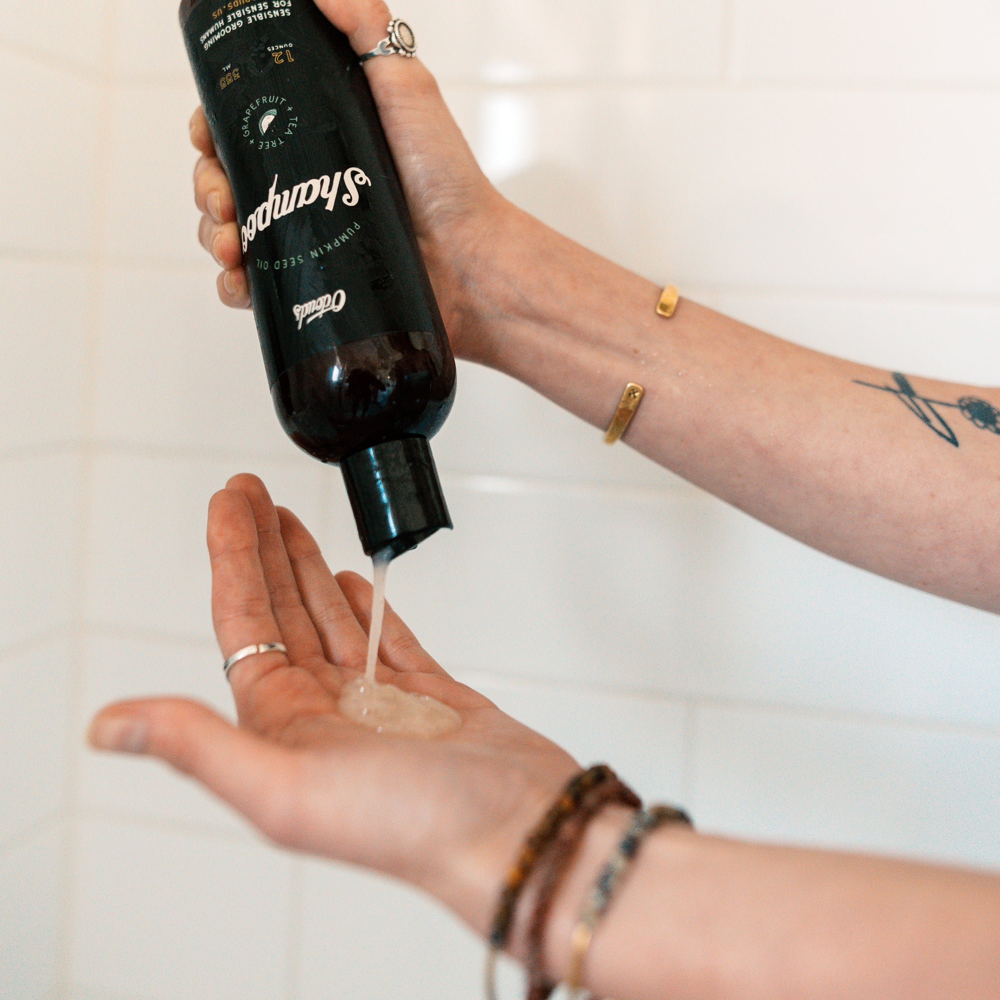 Tea Tree and Grapefruit Scented O'douds Pumpkin Seed Oil Shampoo poured into hand